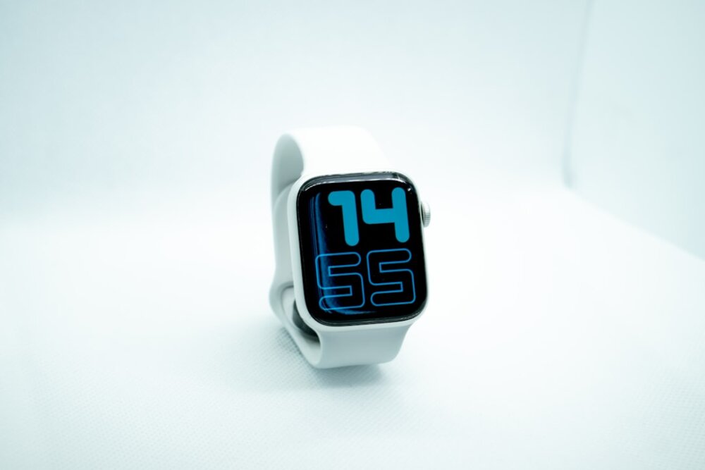 white and blue digital watch