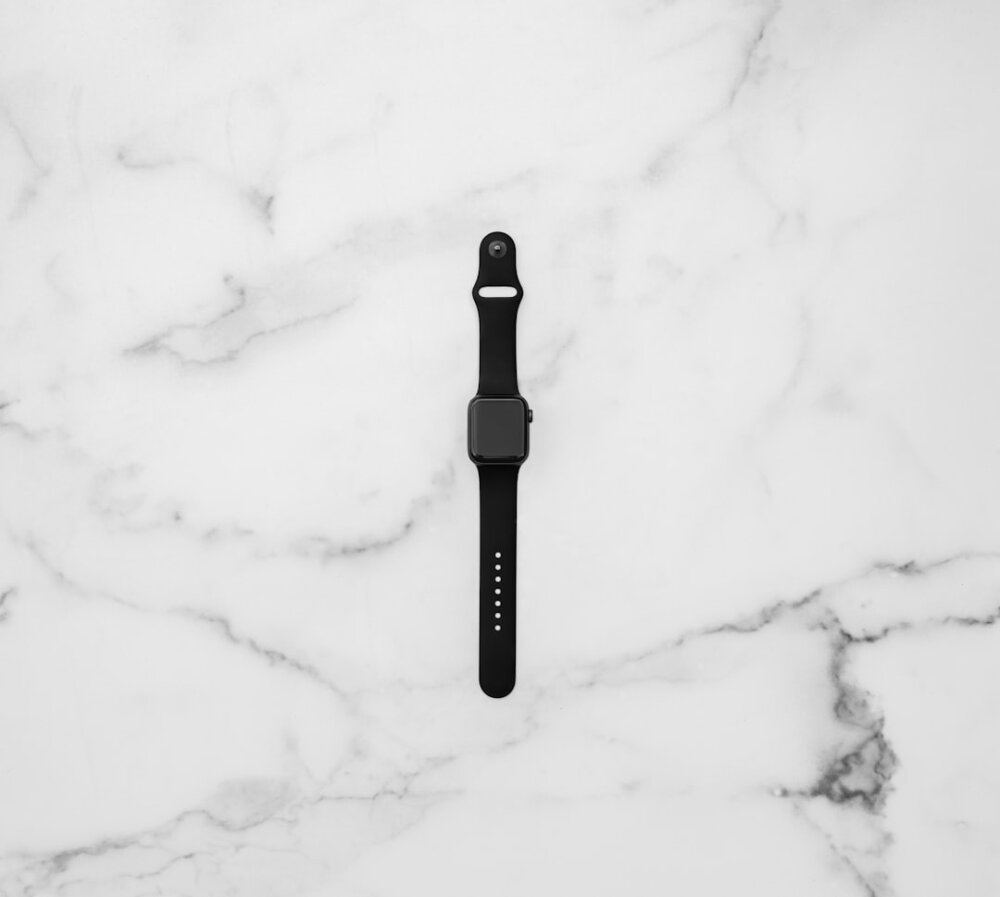 black apple watch on white snow